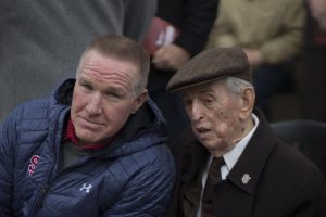 Men's basketball head coach Chris Mullin talks to former men's coach Lou Carnesecca during the unveiling of a statue honoring Joe Lapchick. 