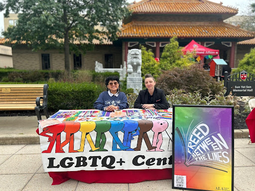 Leslie Alhakim (left) and Dr. Candice D. Roberts (right) outside of Sun Yat Sen with flyers and merchandise to inform students of Banned Books Week. 
Torch Photo / Isabella Acierno