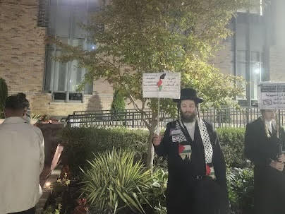 Pictured: Member of Neturei Karta International at the vigil before being escorted off campus by public safety
Torch Photo / Malak Kassem